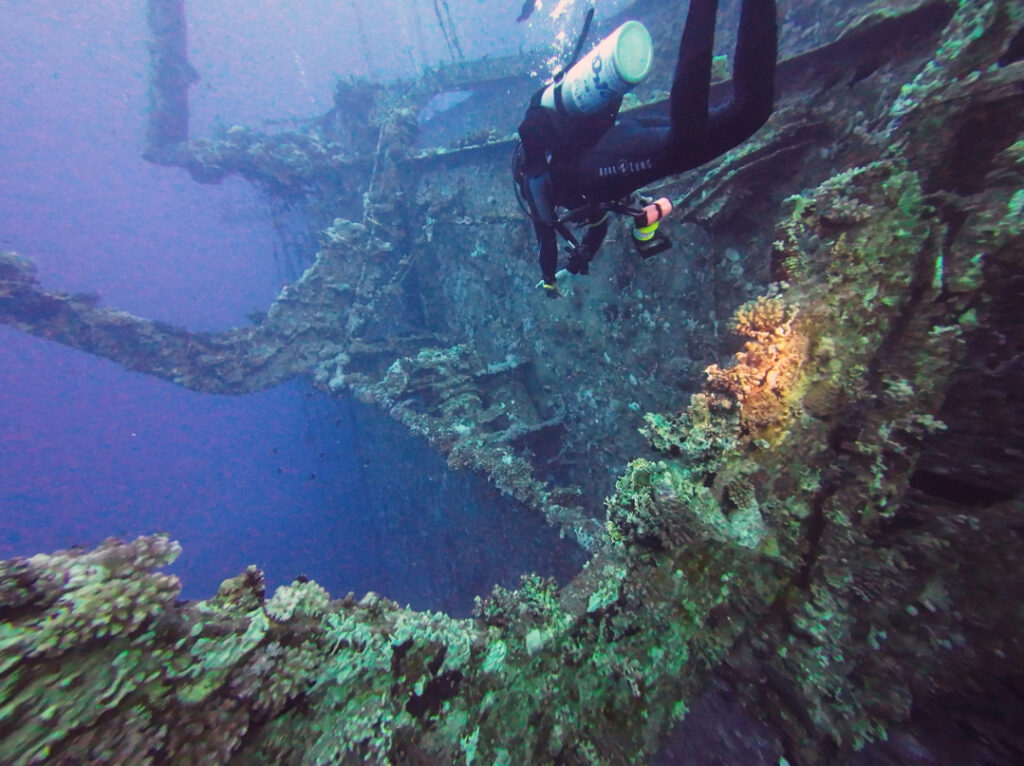 A diver swims around wreck, The Salem Express